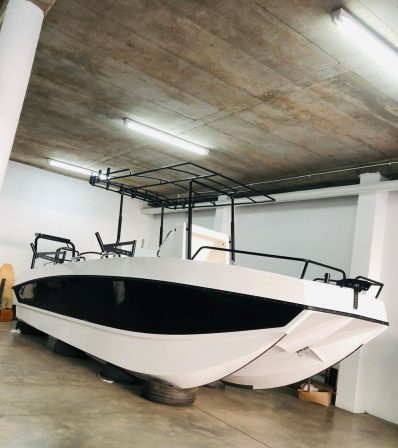 black and white boat with black brackets