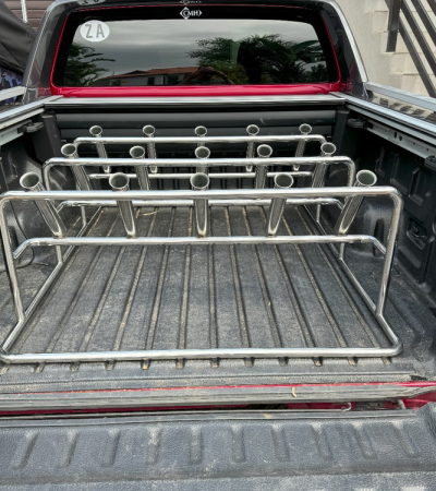 red vehicle with fishing pole holders