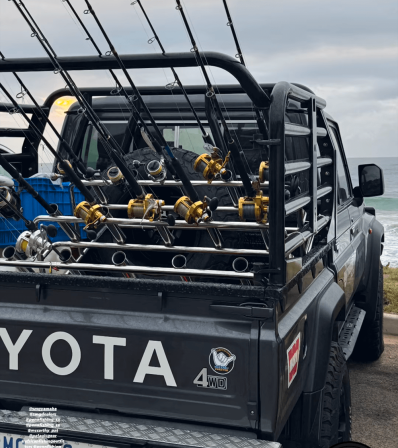 Toyota railings holding fishing poles